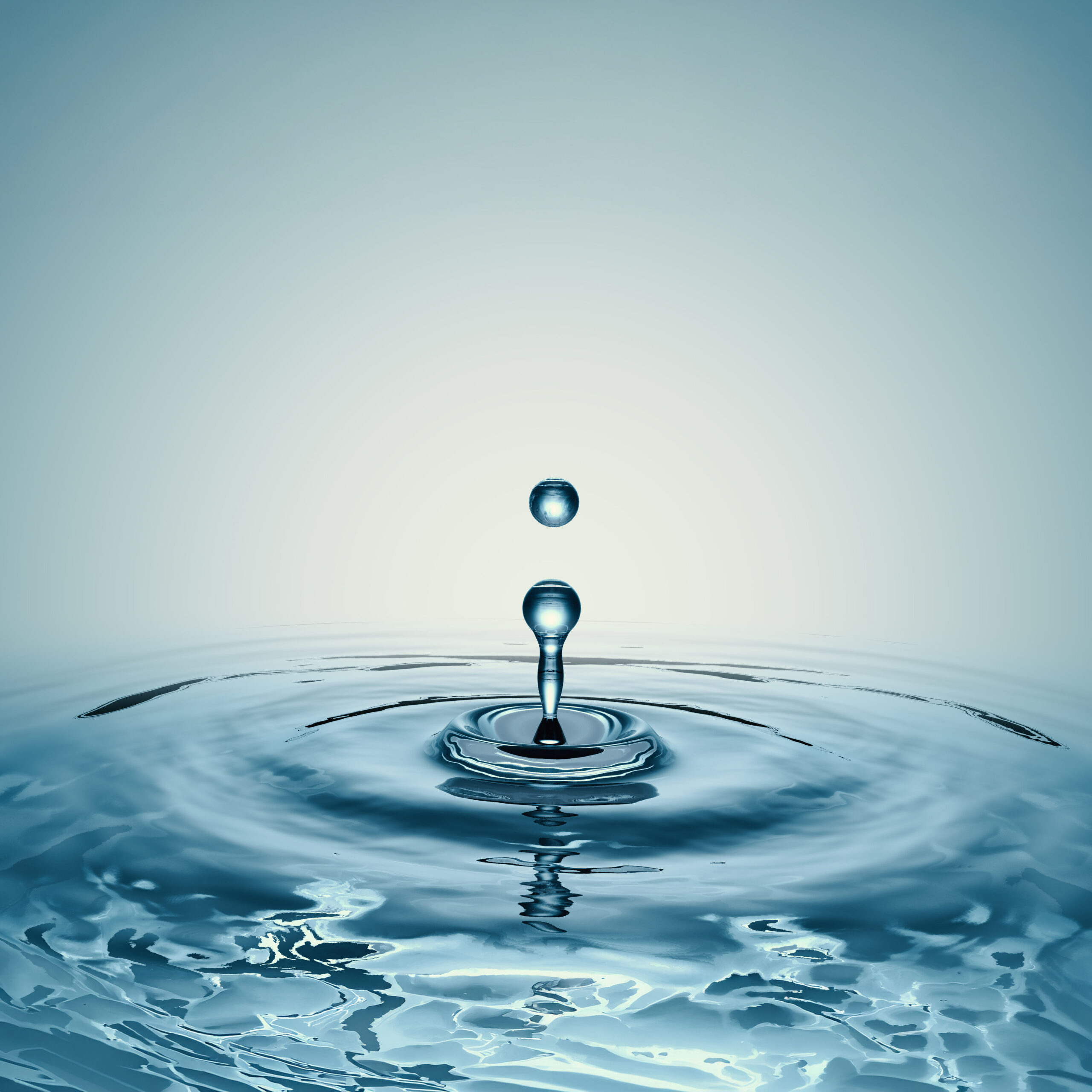 clear water drop with circular waves clear water drop with circular waves